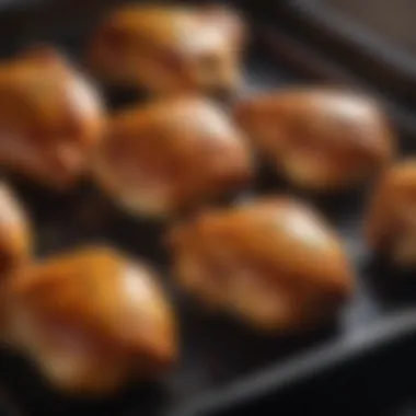 Golden Brown Chicken Thighs in the Oven An oven with a tray of chicken thighs baking to golden perfection