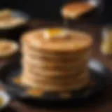 Golden brown pancakes stacked high in a cast iron skillet