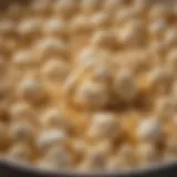 Close-up of golden, gooey marshmallow mixture bubbling in a pot