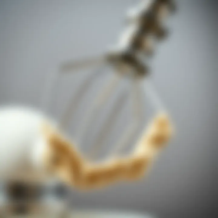 A close-up view of a dough hook showcasing its sleek design and metal finish