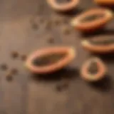 Dried papaya seeds scattered on a wooden surface