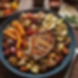 A colorful plate of roasted vegetables and grilled chicken