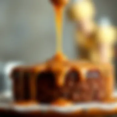 A close-up of caramel sauce being drizzled atop a freshly baked cake