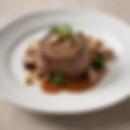 A beautifully plated filet mignon topped with a velvety mushroom sauce