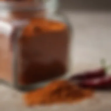 A close-up view of a spice jar filled with chili powder