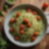 Zucchini noodles topped with fresh pesto and cherry tomatoes