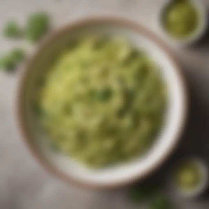 A vibrant bowl of zoodles topped with a rich avocado sauce and fresh herbs.