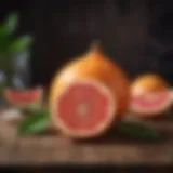 A vibrant pomelo fruit displayed on a rustic wooden table