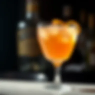A close-up of a classic cocktail garnished with citrus zest