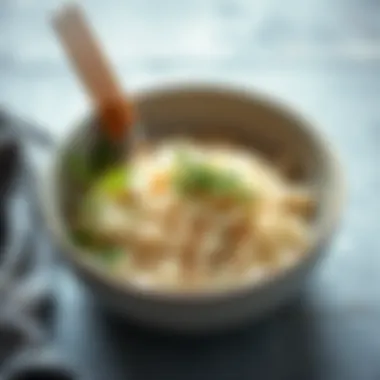 A bowl of shirataki rice garnished with fresh herbs