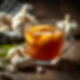 A steaming cup of garlic tea with fresh garlic cloves beside it