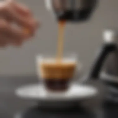 The Art of Pouring a Perfect Espresso Pouring freshly brewed espresso into a cup