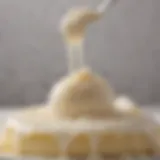 A close-up view of shimmering vanilla raspado syrup drizzling over a dessert