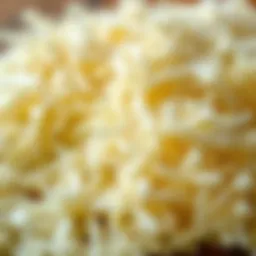 A close-up view of freshly shredded mozzarella cheese ready for freezing