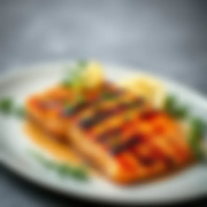 Plated Grilled Honey Salmon with Herbs Plated grilled salmon garnished with fresh herbs and lemon