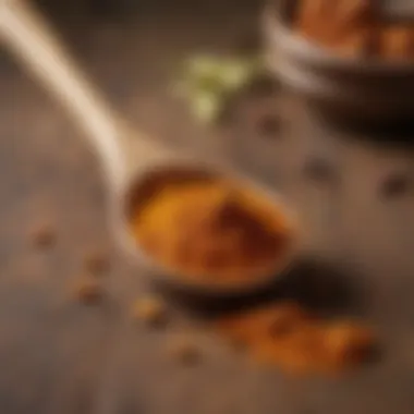 Ground Turmeric Detail Close-up of ground turmeric with a wooden spoon