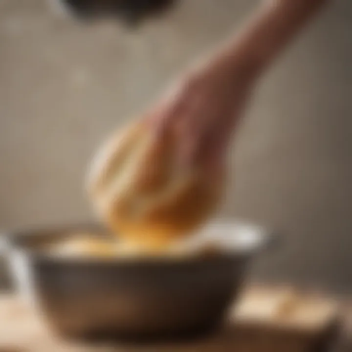 A close-up of fresh dough being kneaded by a bread mixer