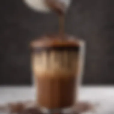 A close-up view of rich chocolate syrup being drizzled over a luscious iced mocha coffee.