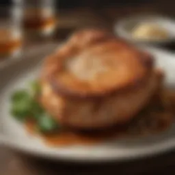 Golden brown Southern fried pork chop served on a rustic plate