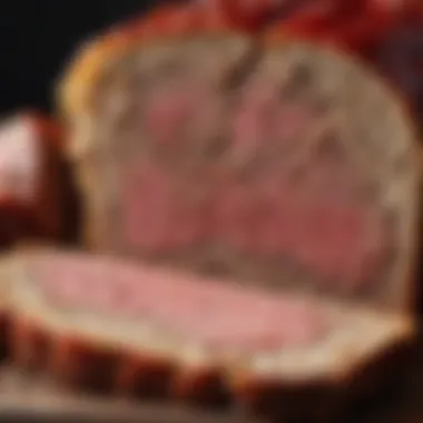 A close-up of meatloaf sliced to reveal its juicy interior