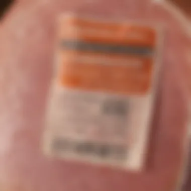 Close-up of nutritional labels on cooked ham packaging