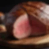 A perfectly roasted eye of round beef on a wooden cutting board, showcasing its juicy interior.