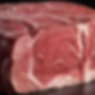 Close-up of marbled beef, emphasizing its texture and quality.