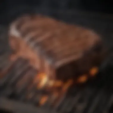 A close-up view of a masterfully charred steak on the grill