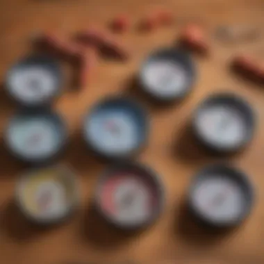 An assortment of various types of BBQ smoker thermometers arranged on a wooden table.