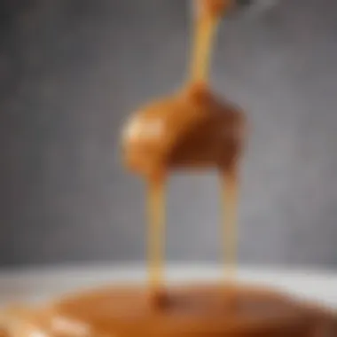 A close-up of the caramel drizzling over a dessert