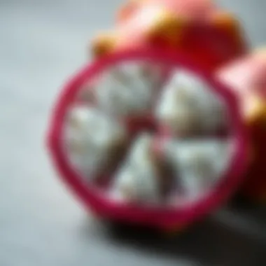 Sliced pitaya revealing its white flesh and tiny black seeds